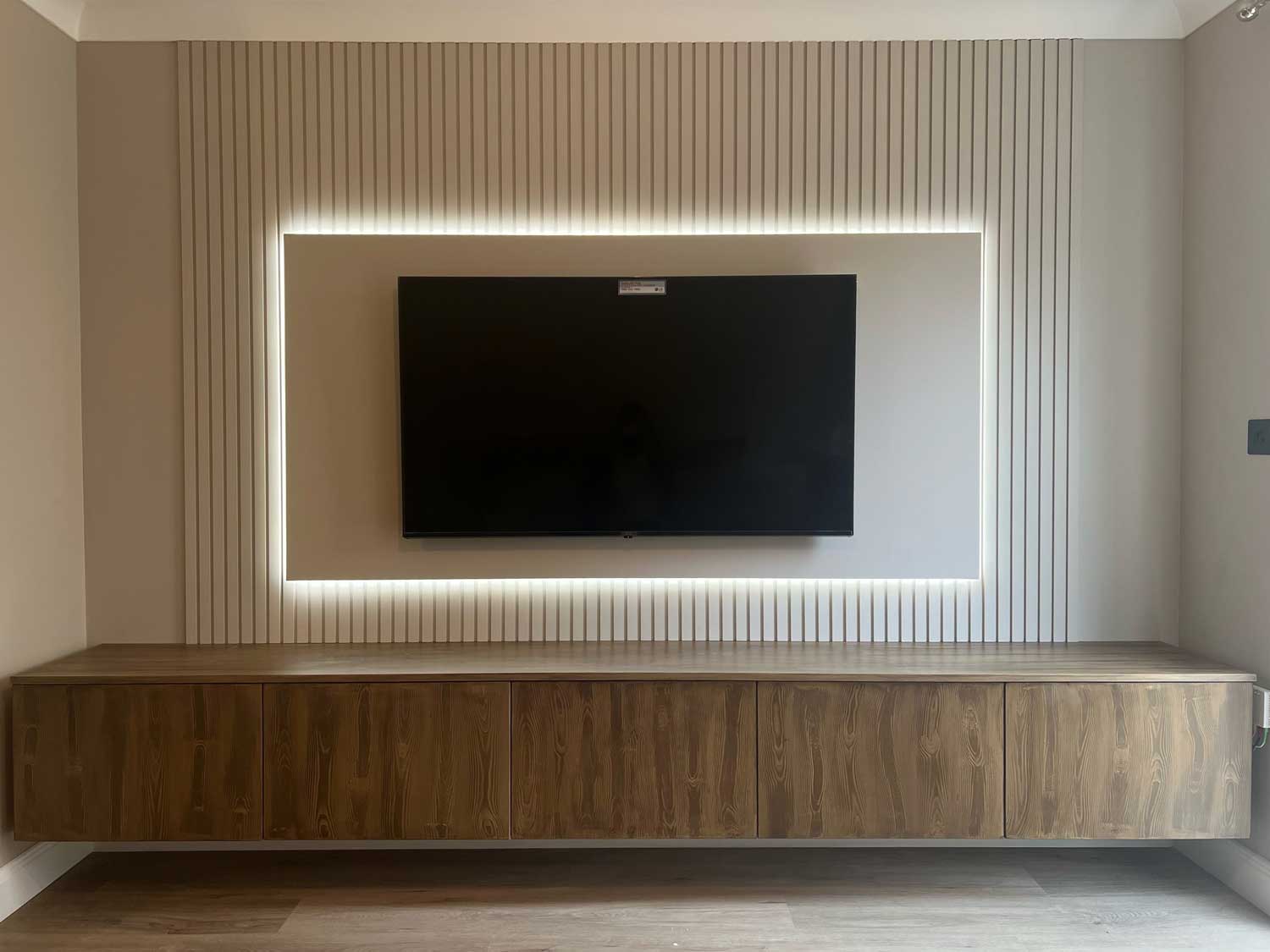 Slatted feature wall for a TV and media unit